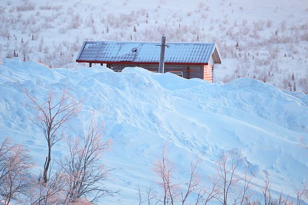 A tiny house in cold weather and snow