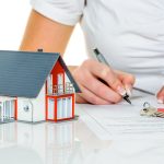 tiny house financing woman signing loan